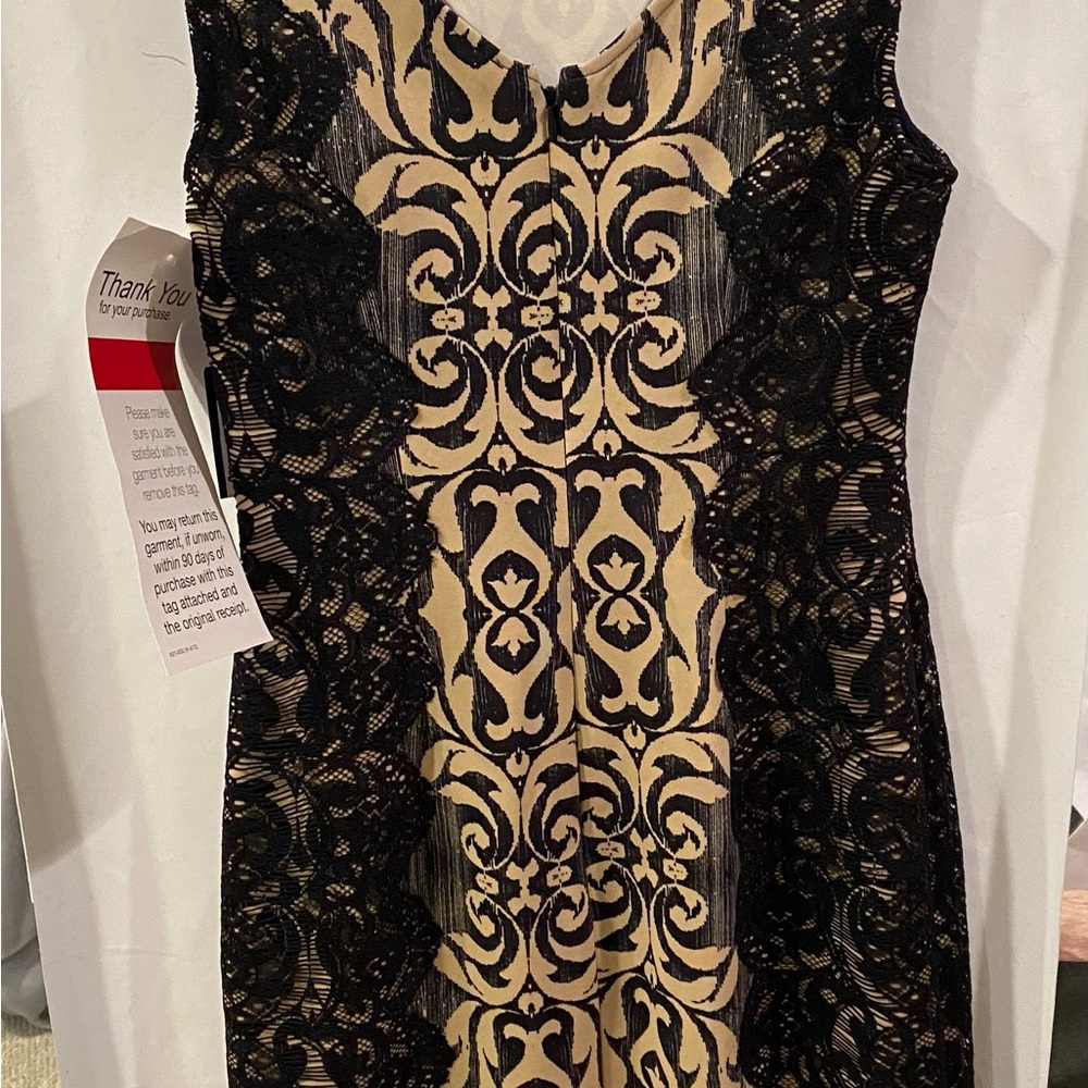 Below the knee dress with lace details down the sides.